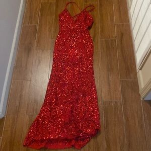 This is a red sequence formal dress that is a size 3.